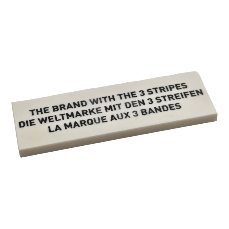 LEGO&reg; 6333990 - 69729pb006 - Tile 2 x 6 with Adias-slogan Pattern
