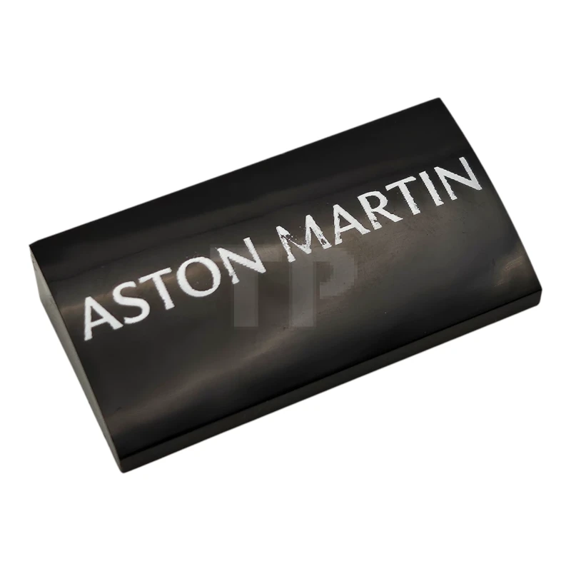 LEGO&reg; 88930pb185 - 6521232 - Slope, Curved 2 x 4 x 2/3 with Bottom Tubes with White 'ASTON MARTIN' Pattern